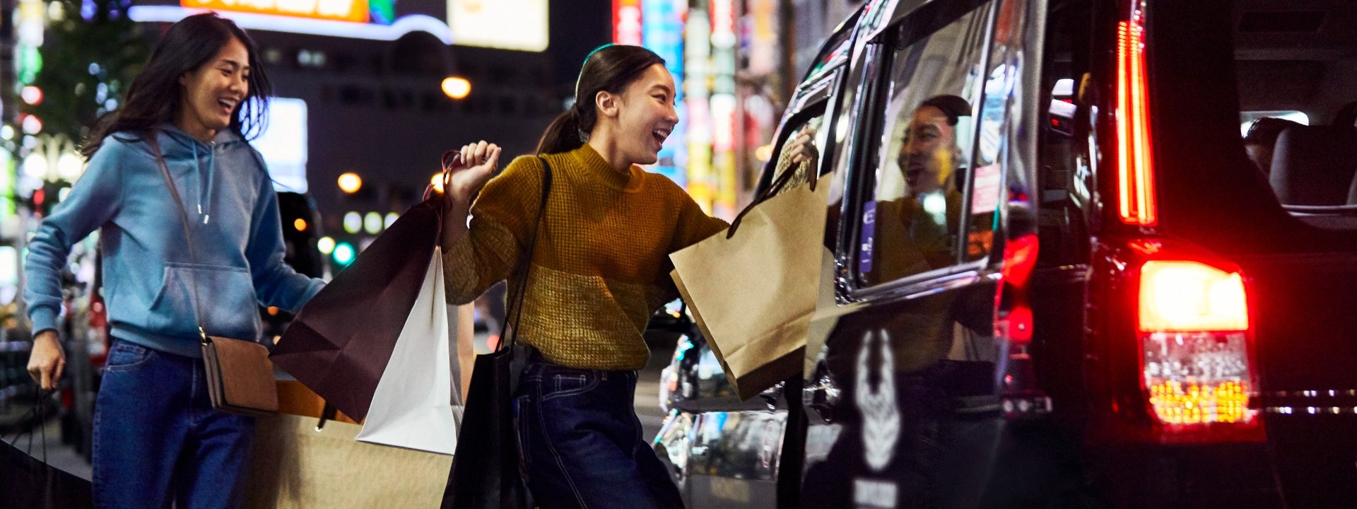 Women with shopping bags on a street in Tokyo