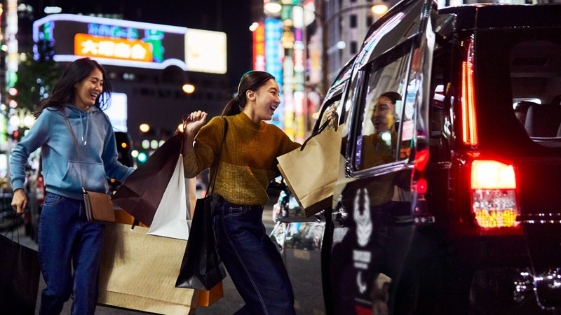 Women with shopping bags on a street in Tokyo