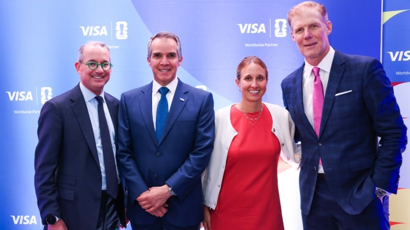 Robert Thomson, Eduardo Coello, Amy Hopfinger, and Alexi Lalas pose at the Visa FIFA World Cup 2026™ reception with Visa logo backdrop.